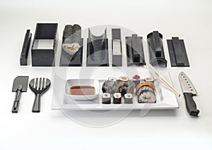 Complete kit for making sushis seen overhead on white background photo