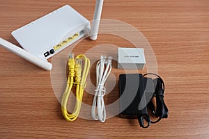 Complete set Modem router wifi wireless, lan and adsl cable, splitter, and Adapter on wooden