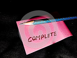 complete text displayed on pink paper slip with pencil pointer isolated