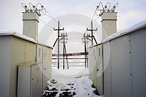 Complete transformer substations in winter on the field.