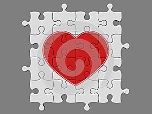 Completed mosaic from puzzles with symbol of heart photo