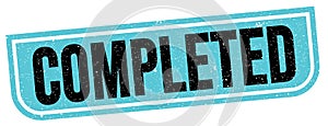 COMPLETED text written on blue-black stamp sign