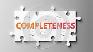 Completeness complex like a puzzle - pictured as word Completeness on a puzzle pieces to show that Completeness can be difficult photo