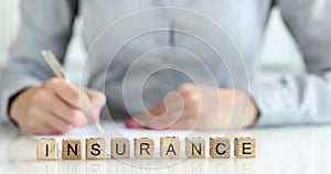 Completing insurance form for company reference closeup