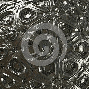 Complex geometric pattern with a metallic, reflective surface. Features interlocking