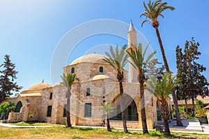 The complex of Hala Sultan Tekke is the notable landmark, located on the bank of Larnaca Salt lake, Cyprus. photo