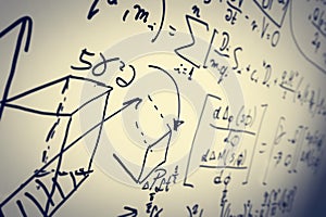 Complex math formulas on whiteboard. Mathematics and science with economics