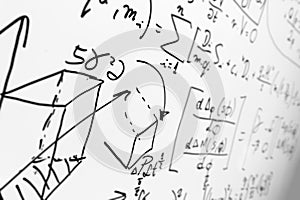 Complex math formulas on whiteboard. Mathematics and science with economics