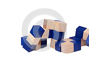 Complex mind challenging puzzle, blue wooden cubes forming a snake isolated on white background