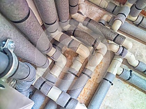 Complex Network of Insulated Pipes in an Industrial Setting. maze of thermally insulated pipes arranged in a complex