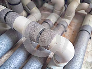 Complex Network of Insulated Pipes in an Industrial Setting. maze of thermally insulated pipes arranged in a complex