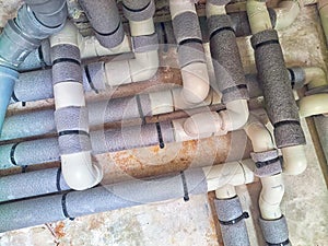 Complex Network of Insulated Pipes in an Industrial Setting. maze of thermally insulated pipes arranged in a complex