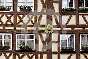 Complex pattern of intersecting timbers in facade of half-timbered medieval house in Mainz, Germany