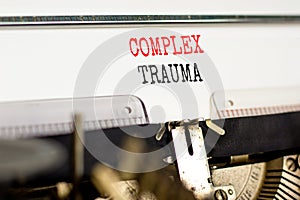 Complex trauma symbol. Concept words Complex trauma typed on white paper on old retro typewriter. Beautiful white background.