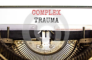 Complex trauma symbol. Concept words Complex trauma typed on white paper on old retro typewriter. Beautiful white background.