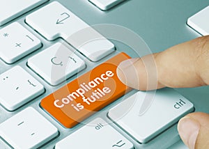 Compliance is futile - Inscription on Orange Keyboard Key