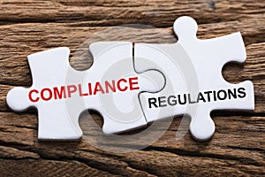 Compliance And Regulations Words On Jigsaw Puzzle