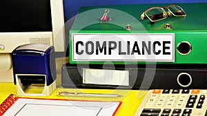 Compliance. Text label on the folder office of the Registrar. photo