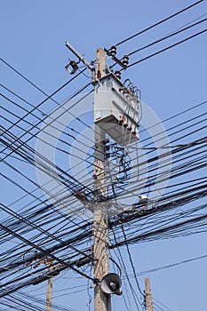 Complicate electric cable at intersection on post photo
