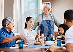 Compliments to the chef. a happy family having lunch together at home.