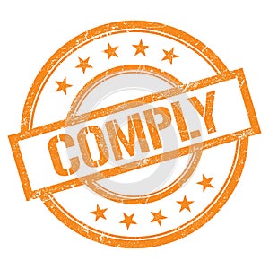 COMPLY text written on orange vintage stamp