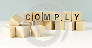 COMPLY word made with building blocks