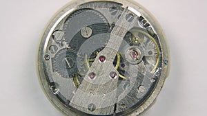 Components of old watch mechanism. Top view vintage clock mechanism working