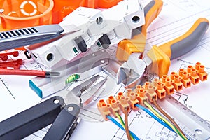 Components for use in electrical installations. Cut pliers, connectors, fuses and wires. Accessories for engineering work. photo