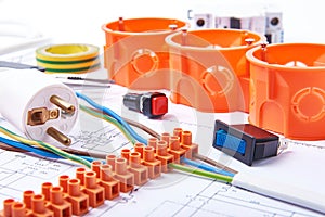 Components for use in electrical installations. Plug, connectors, junction box, switch, isolation tape and wires. Accessories for photo