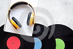 Compose music. Vinyl records, headphones, music notes on grey background top view copyspace