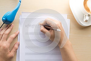 composing music note top view with hand writing coffee and blue