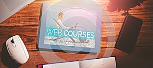 Composite 3d image of businessman learning on the beach