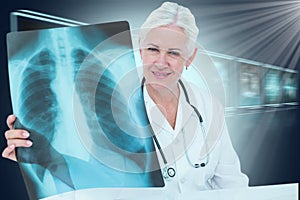 Composite 3d image of portrait of smiling female doctor examining chest x-ray