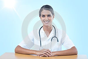 Composite 3d image of portrait of smiling female doctor sitting at desk