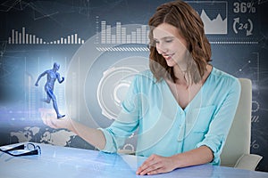 Composite 3d image of smiling businesswoman sitting at desk and using digital screen