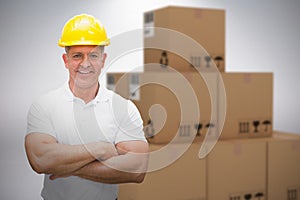 Composite 3d image of worker wearing hard hat in warehouse
