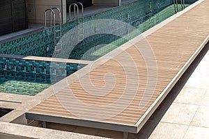 Composite deck installed on the edge of the swimming pool