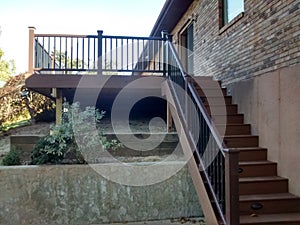 Composite deck with pecan decking and mocha railing photo