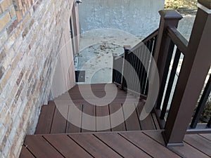 Composite deck with pecan decking and mocha railing photo