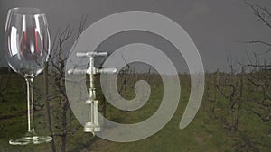 Composite of glass, bottle of red wine and corkscrew over vineyard background