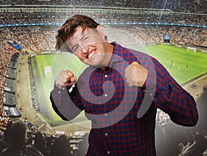 Composite with happy and excited soccer fan man and football pitch background celebrating his team scoring and winning in sport