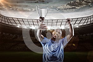 Composite image 3D of happy sportsman looking up and cheering while holding trophy