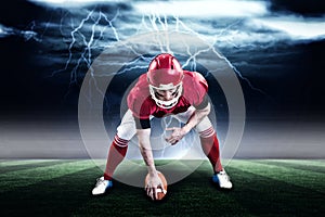 Composite image of american football player starting football game 3d