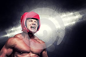 Composite image of angry boxer with headgear