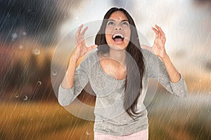 Composite image of angry brunette shouting