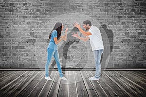 Composite image of angry couple shouting at each other