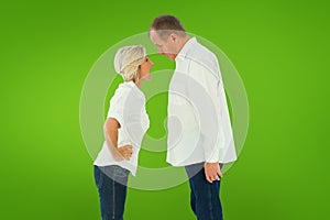 Composite image of angry older couple arguing with each other