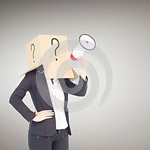 Composite image of anonymous businesswoman holding a megaphone