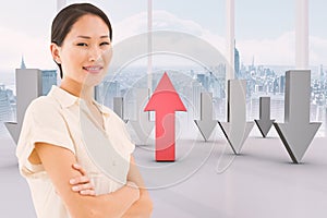 Composite image of asian businesswoman with arms crossed