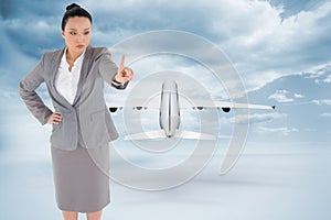 Composite image of asian businesswoman pointing